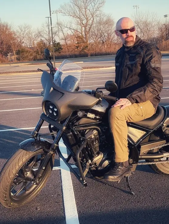 Jonathan Heavner, seated on his motorcycle outdoors.